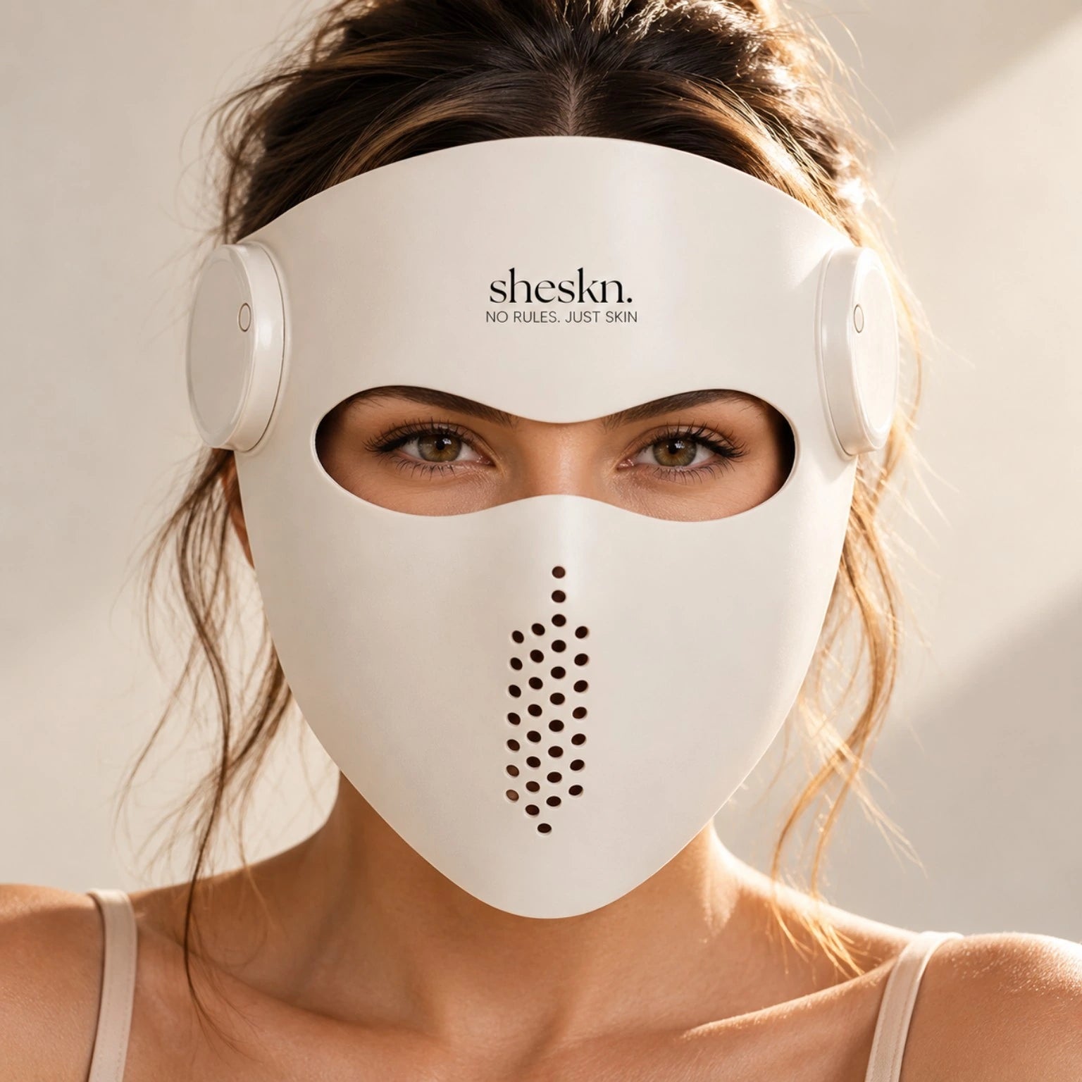 Luméskn LED light therapy face mask shown from the front on model