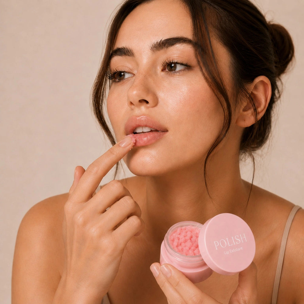 Woman applying Sheskn POLISH lip exfoliant scrub for smoother, softer lips