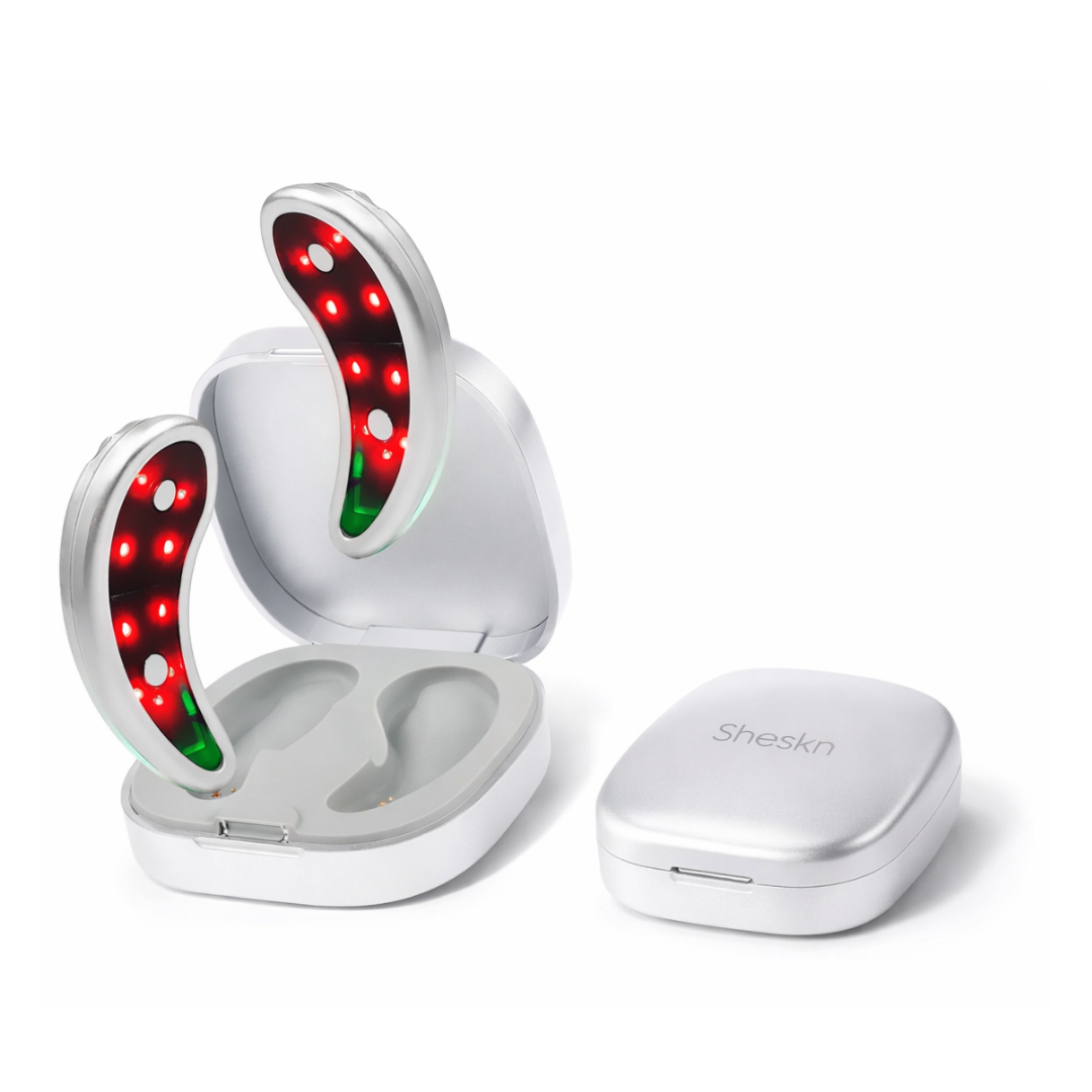Sheskn Eye Therapy LED EMS device in open charging case for dark circles and under eye puffiness treatment